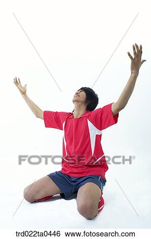 cheering supporters holding their hands high View Large Photo Image Stock Photograph - cheering supporters holding their hands high. Fotosearch