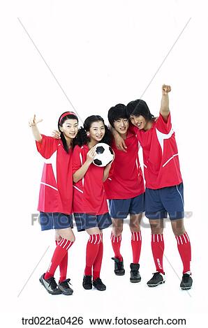 Stock Photograph - supporters holding their hands with a ball high. Fotosearch