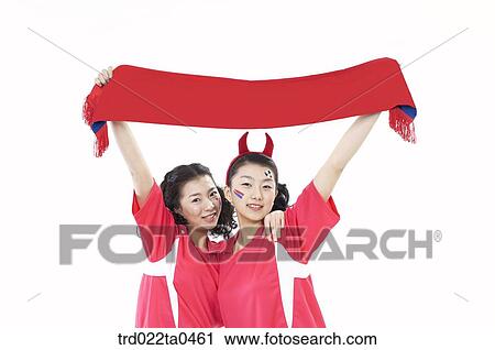 two cheering supporters holding a towel View Large Photo Image Stock Image - two cheering supporters holding a towel. Fotosearch