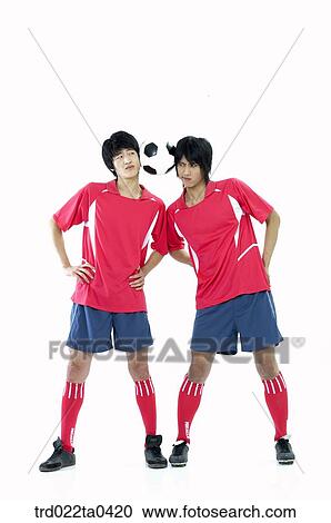 two men holding a ball View Large Photo Image Stock Image - two men holding a ball. Fotosearch