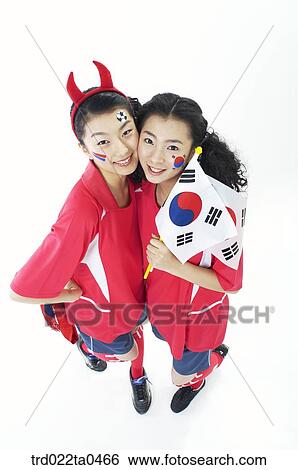 two supporters holding a flag View Large Photo Image Stock Photograph - two supporters holding a flag. Fotosearch