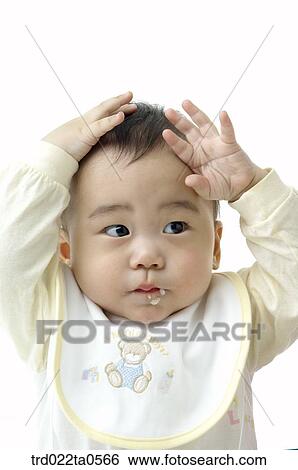 a baby eating baby food View Large Photo Image Stock Photograph - a baby eating baby food. Fotosearch
