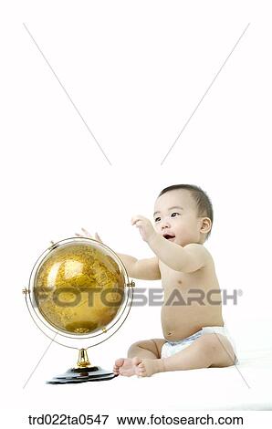 a baby in front of a globe View Large Photo Image Stock Photo - a baby in front of a globe. Fotosearch