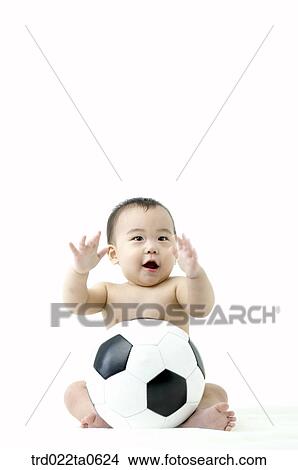 a baby playing a soccer ball View Large Photo Image Picture - a baby playing a soccer ball. Fotosearch