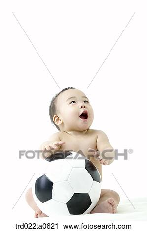 a baby playing a soccer ball View Large Photo Image Stock Image - a baby playing a soccer ball. Fotosearch