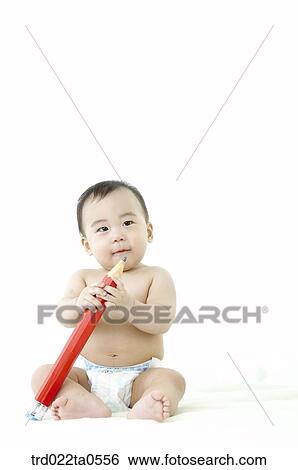 a baby playing a toy View Large Photo Image Stock Photograph - a baby playing a toy. Fotosearch