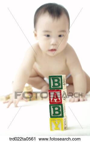 a baby playing blocks View Large Photo Image Stock Image - a baby playing blocks. Fotosearch