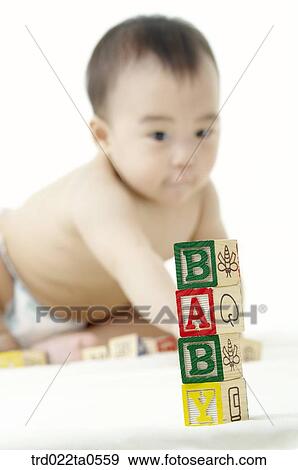 a baby playing blocks View Large Photo Image Stock Photo - a baby playing blocks. Fotosearch