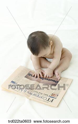 a baby reading a newspaper View Large Photo Image Stock Image - a baby reading a newspaper. Fotosearch