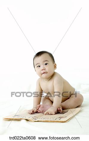 a baby reading a newspaper View Large Photo Image Stock Photo - a baby reading a newspaper. Fotosearch