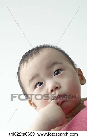 a baby sucking his fingers View Large Photo Image Stock Photo - a baby sucking his fingers. Fotosearch