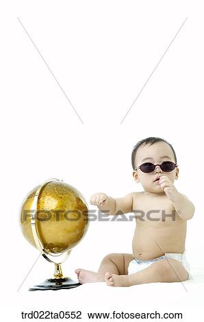 a baby wearing sunglasses in front of a globe View Large Photo Image Stock Image - a baby wearing sunglasses in front of a globe. Fotosearch