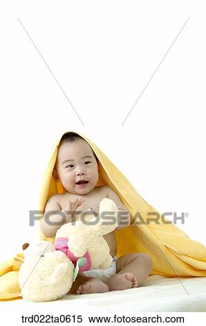 a baby with a bear doll View Large Photo Image Stock Photography - a baby with a bear doll. Fotosearch