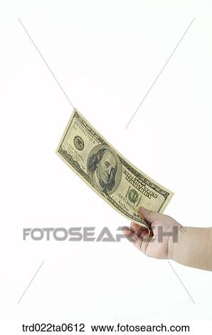 a baby's hand and a dollar View Large Photo Image Stock Image - a baby's hand and a dollar. Fotosearch