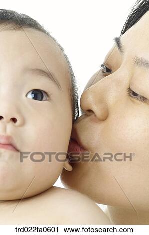 a kissing baby and his mom View Large Photo Image Stock Image - a kissing baby and his mom. Fotosearch