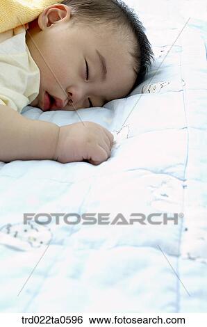 Stock Photograph - a sleeping baby. Fotosearch