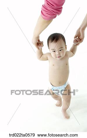 a toddling baby with his mom View Large Photo Image Stock Photo - a toddling baby with his mom. Fotosearch