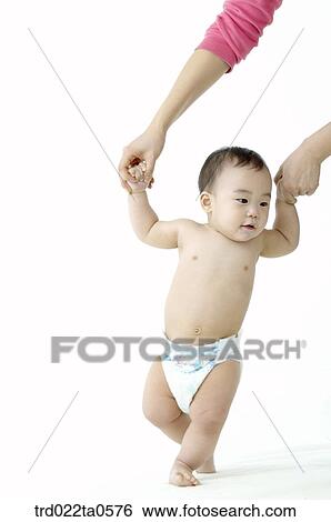 a toddling baby with his mom View Large Photo Image Stock Photograph - a toddling baby with his mom. Fotosearch