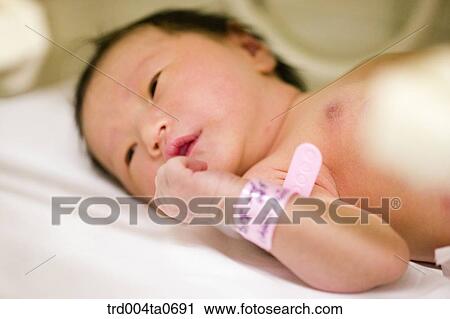 a lying newborn baby View Large Photo Image Stock Image - a lying newborn baby. Fotosearch
