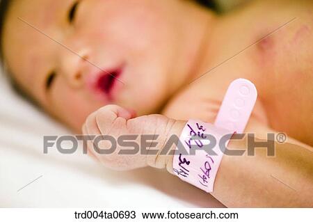 Stock Image - a lying newborn baby. Fotosearch