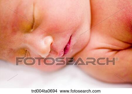 a sleeping newborn baby View Large Photo Image Picture - a sleeping newborn baby. Fotosearch