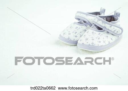 Stock Image - baby supplies/a babyshoe. Fotosearch