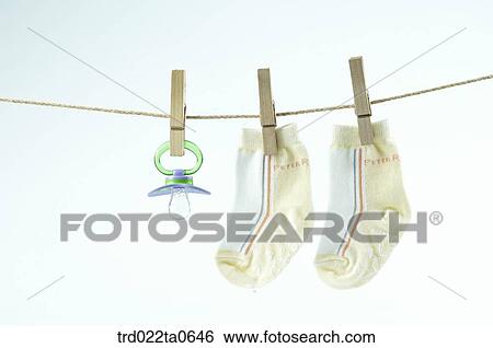 baby supplies/a nipple and socks View Large Photo Image Stock Photograph - baby supplies/a nipple and socks. Fotosearch