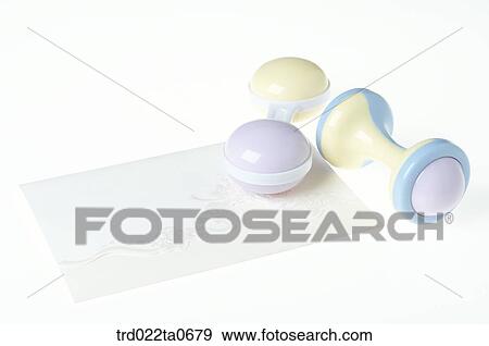 Stock Photo - baby supplies/a noisemaker and a card . Fotosearch
