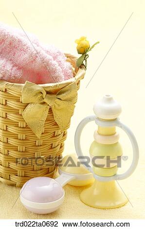 baby supplies/a noisemaker beside a basket View Large Photo Image Stock Image - baby supplies/a noisemaker beside a basket. Fotosearch