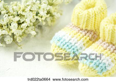 Picture - baby supplies/arctic boots with flower decorations. Fotosearch