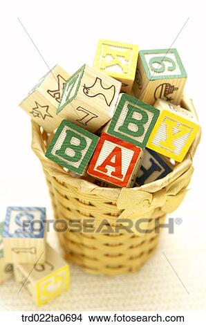 Picture - baby supplies/blocks in a basket. Fotosearch