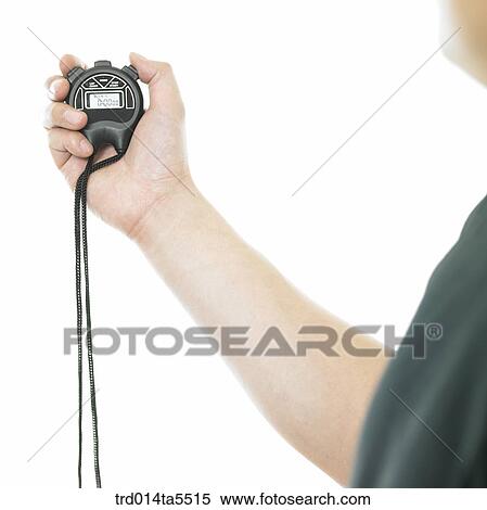 Stock Photography - a man holding a stopwatch. Fotosearch