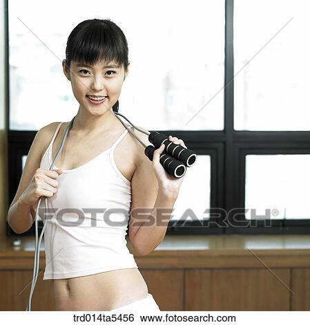 a rope-skipping woman at a fitness club View Large Photo Image Stock Photograph - a rope-skipping woman at a fitness club. Fotosearch