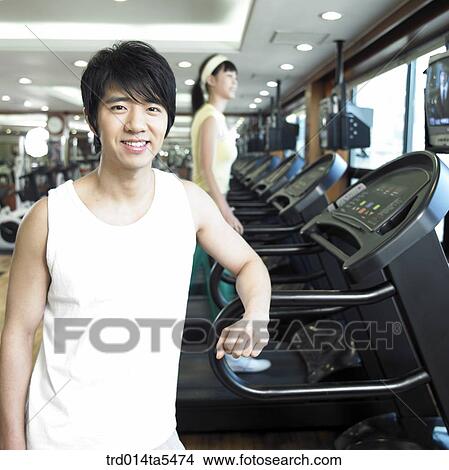 a running man on a running machine at a fitness club View Large Photo Image Picture - a running man on a running machine at a fitness club. Fotosearch
