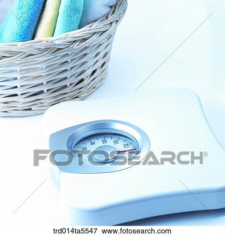 a scale and a towel in a basket View Large Photo Image Stock Photo - a scale and a towel in a basket. Fotosearch