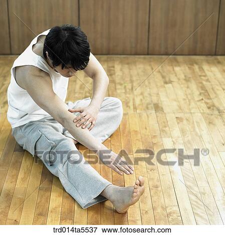 a stretching man View Large Photo Image Stock Photo - a stretching man. Fotosearch