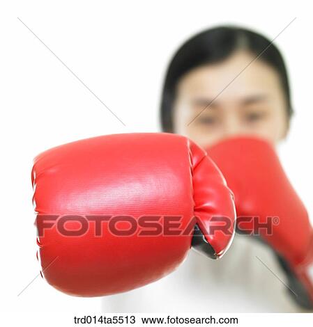a woman wearing boxing gloves View Large Photo Image Stock Image - a woman wearing boxing gloves. Fotosearch