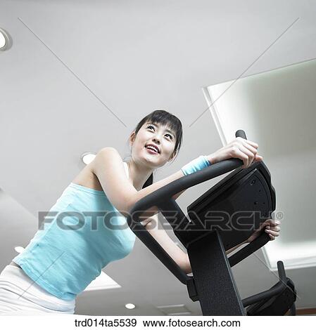 an exercising woman View Large Photo Image Stock Photo - an exercising woman. Fotosearch