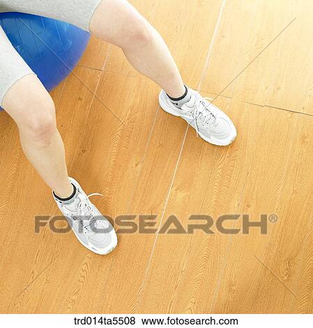an exercising woman with a ball View Large Photo Image Stock Photo - an exercising woman with a ball. Fotosearch