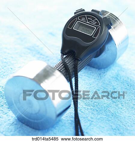 Stock Photography - dumbbells and a stopwatch. Fotosearch