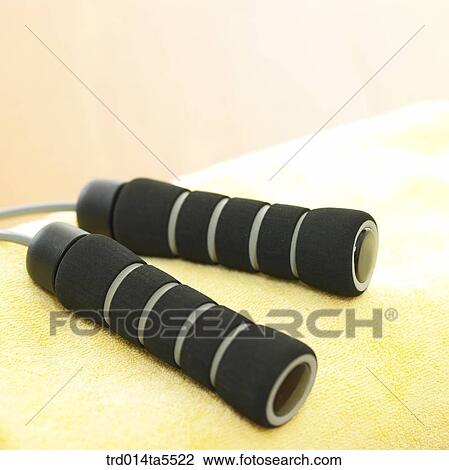 Stock Image - sport goods, a rope and a towel. Fotosearch