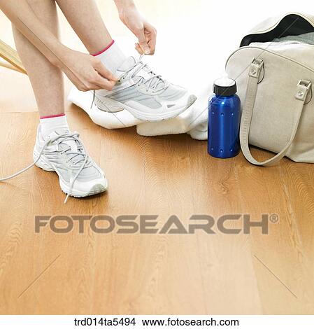 Picture - wearing running shoes. Fotosearch