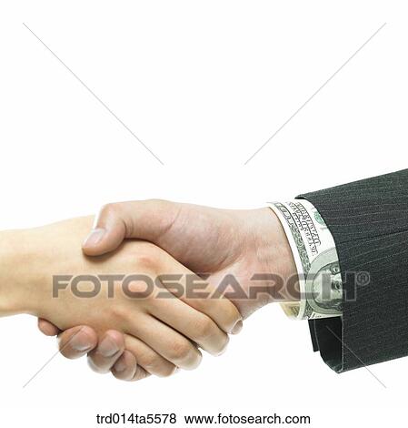 Stock Photo - business concept/a businessman and a businesswoman's handshaking. Fotosearch