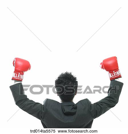 business concept/a businessman wearing boxing gloves View Large Photo Image Stock Photography - business concept/a businessman wearing boxing gloves. Fotosearch