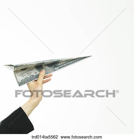business concept/a businesswoman holding a paper airplane View Large Photo Image Stock Image - business concept/a businesswoman holding a paper airplane. Fotosearch