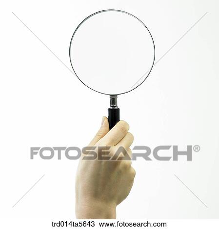 business concept/a hand holding a magnifier View Large Photo Image Stock Image - business concept/a hand holding a magnifier. Fotosearch