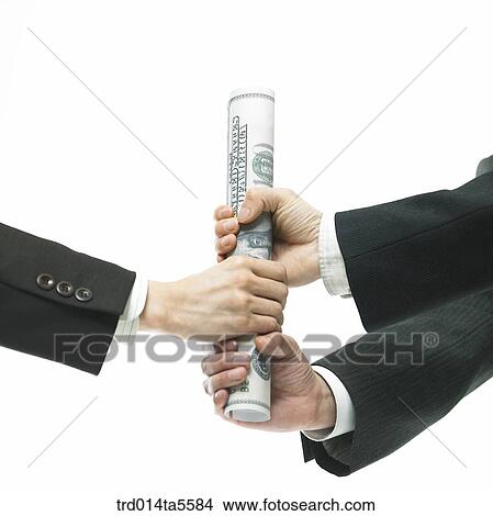 Picture - business concept/holding a baton made of paper money. Fotosearch