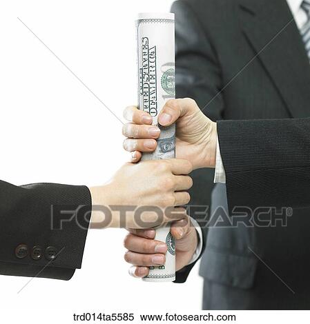 Stock Photography - business concept/holding a baton made of paper money. Fotosearch
