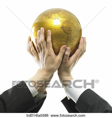 Stock Photograph - business concept/holding a globe. Fotosearch