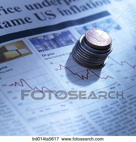 Stock Photo - finance/a coin tower on a newspaper . Fotosearch